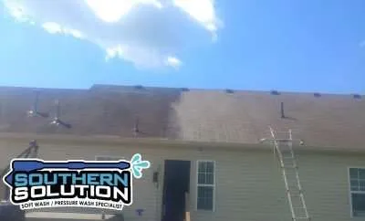 A shingle roof in Dickson, TN half-cleaned.
