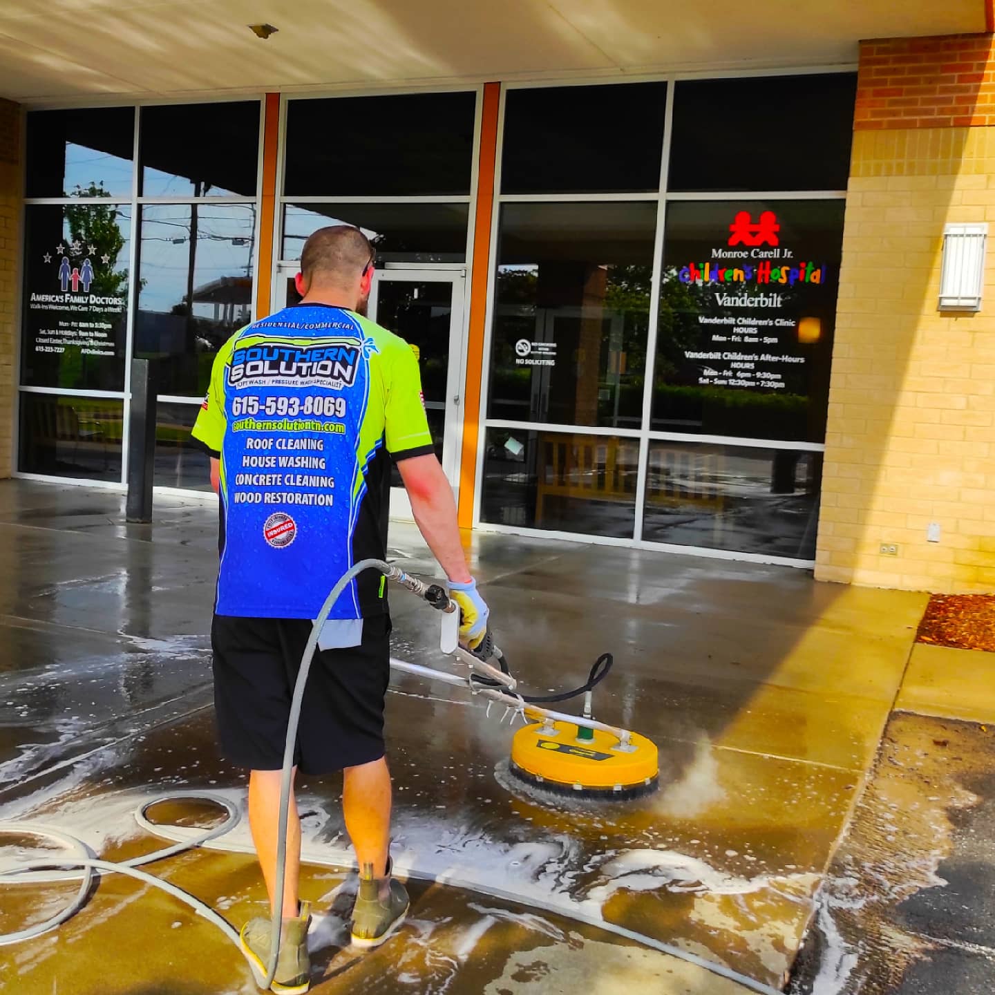 Concrete cleaning in progress at a Middle Tennessee children's hospital, showing the sharp line between dirty and clean.