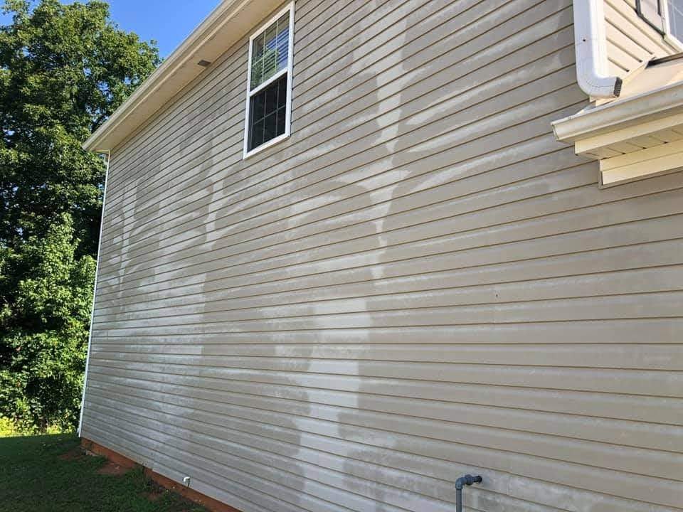 House Washing 6 Permanent siding damage caused by improper high-pressure washing on oxidized siding.