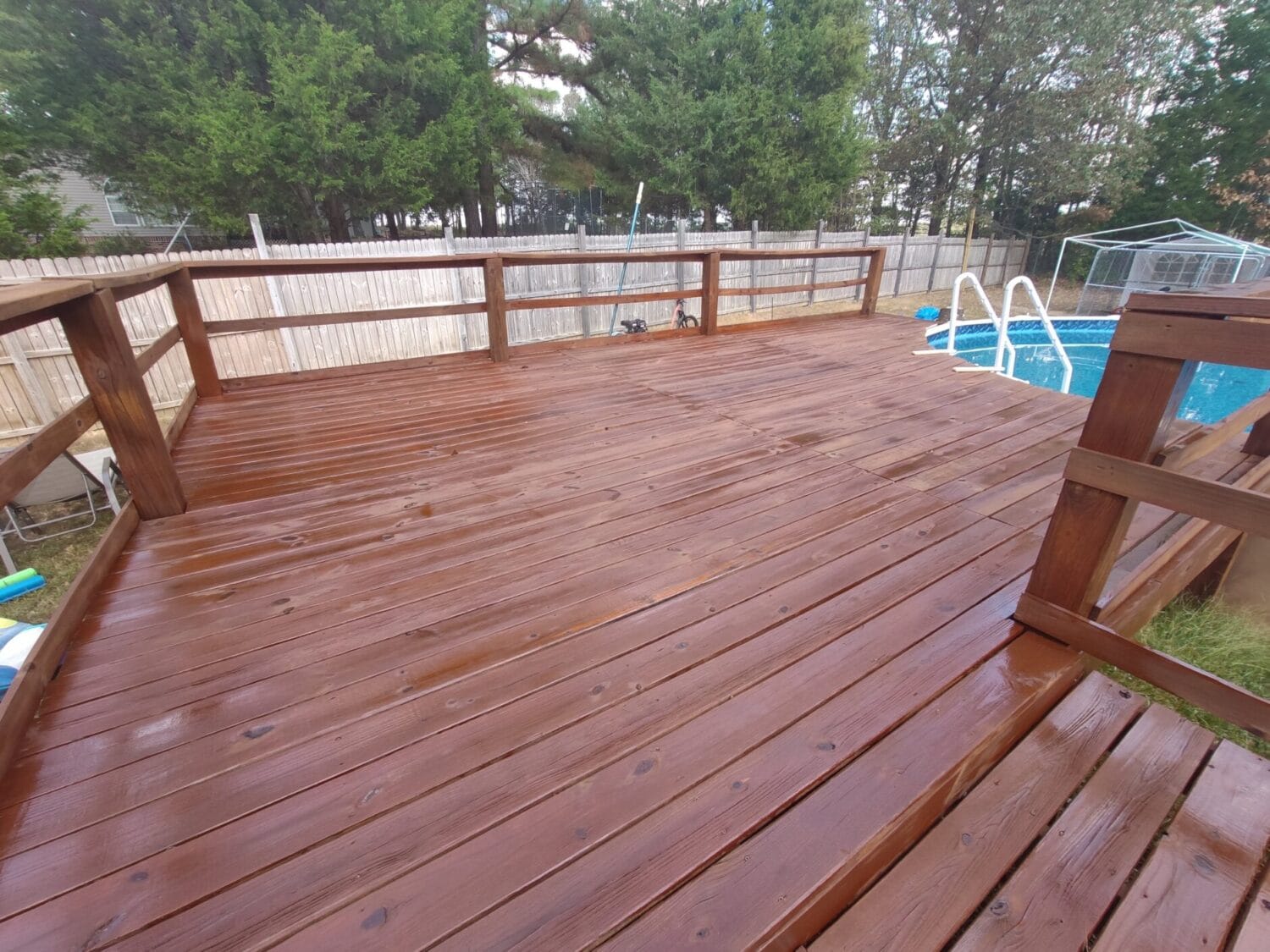 The same deck after wood restoration stripping and fresh stain