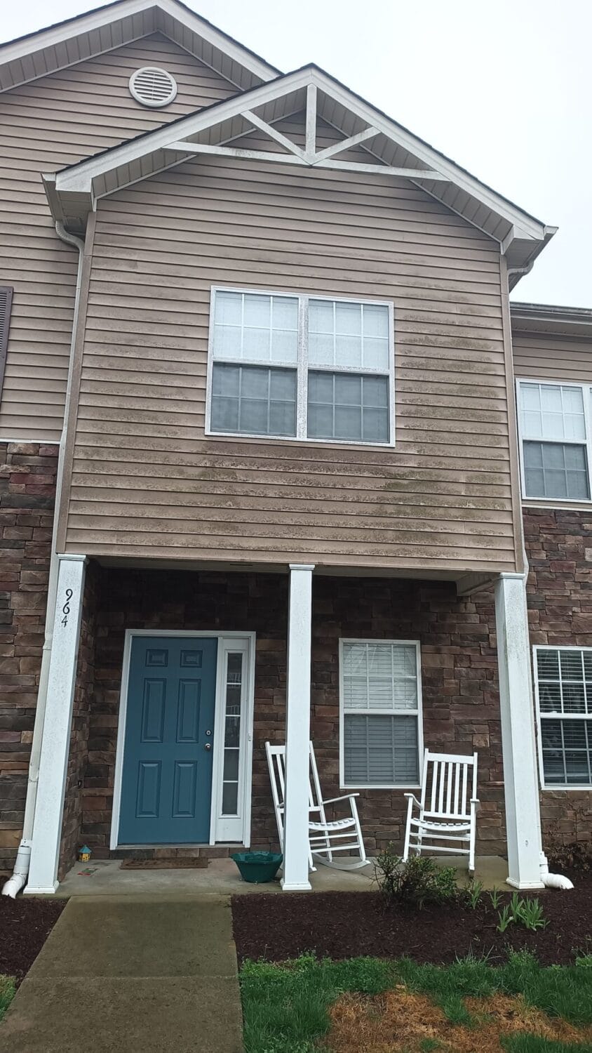 Dirty siding before house washing at an HOA community in Middle Tennessee