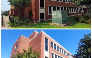 Professional technician soft washing stained brick exterior of commercial building in Franklin, Tennessee