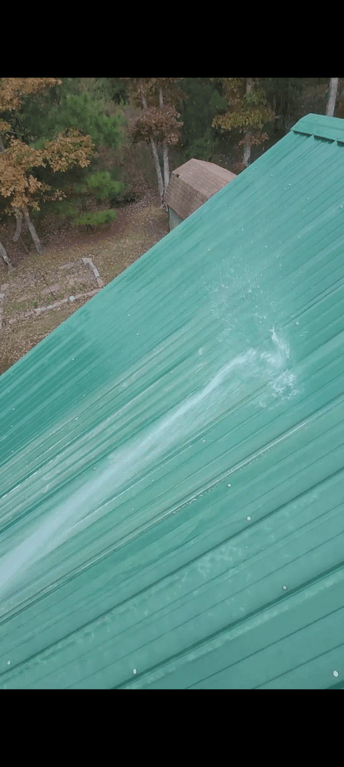 Close-up of a chalky, oxidized metal roof surface.