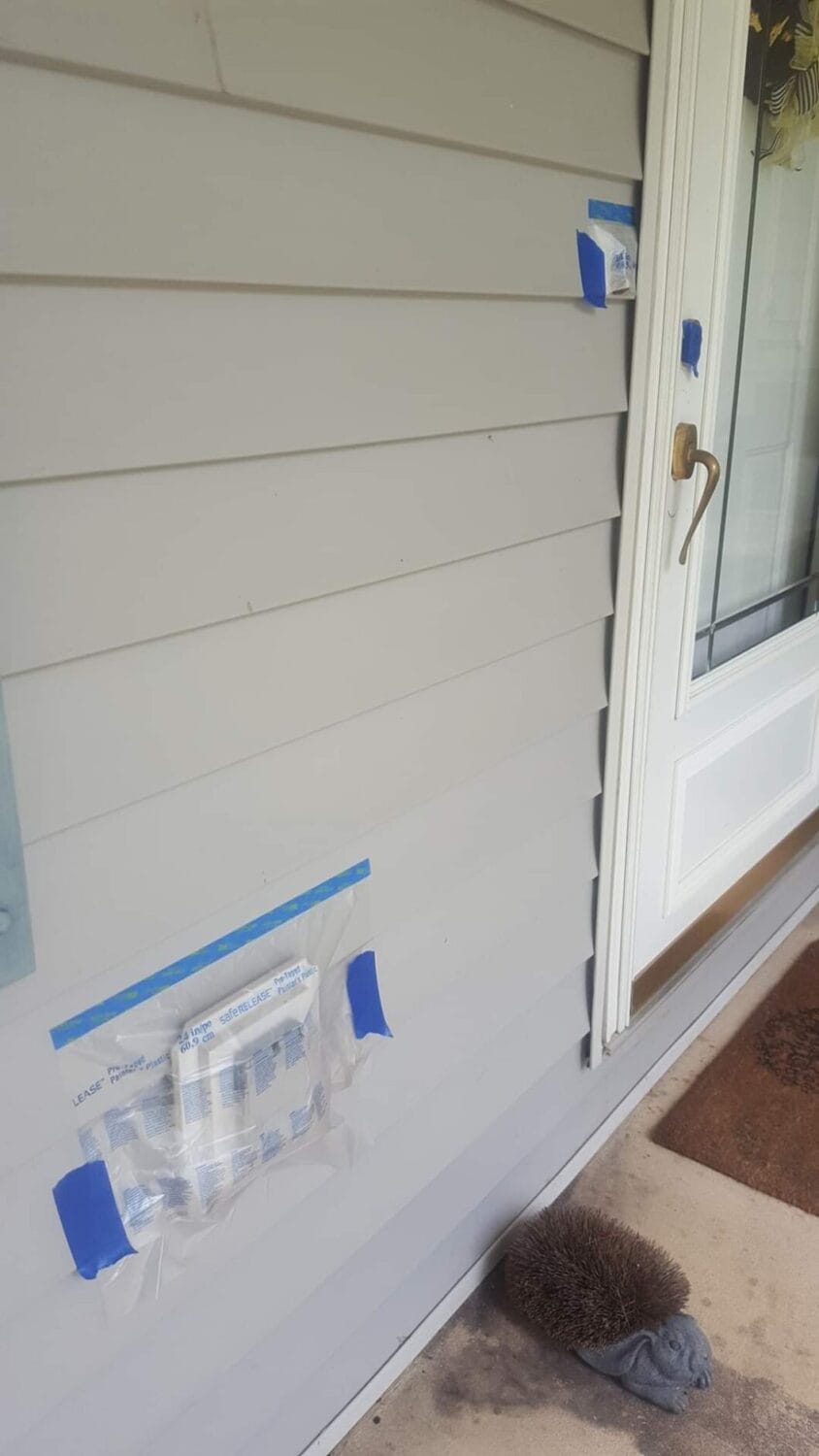 Electronics and fixtures covered and protected before property management cleaning begins.