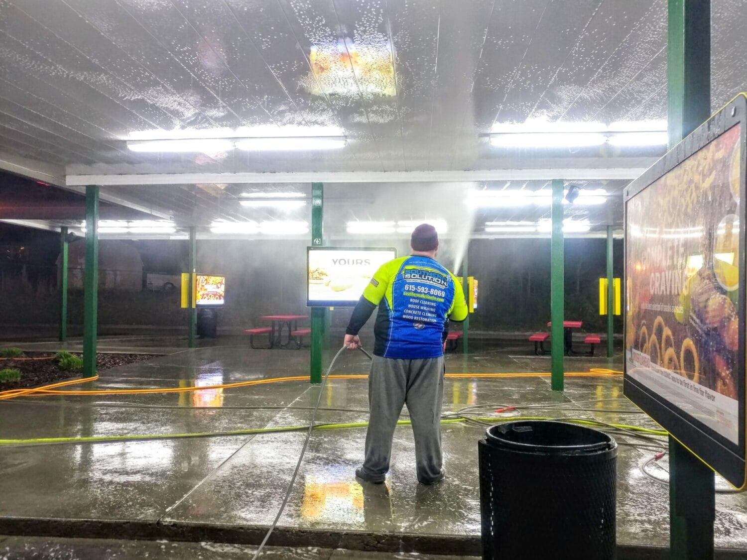 Overhead fuel canopy cleaning for a gas station and drive-in